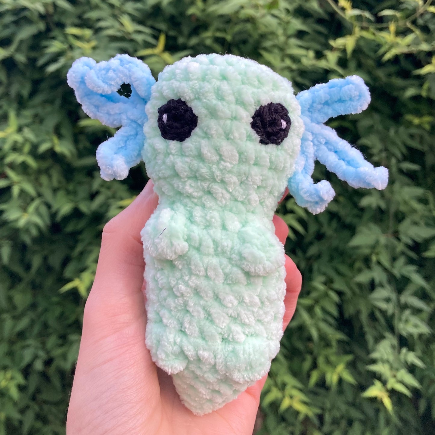 Handmade green axolotl crochet plush